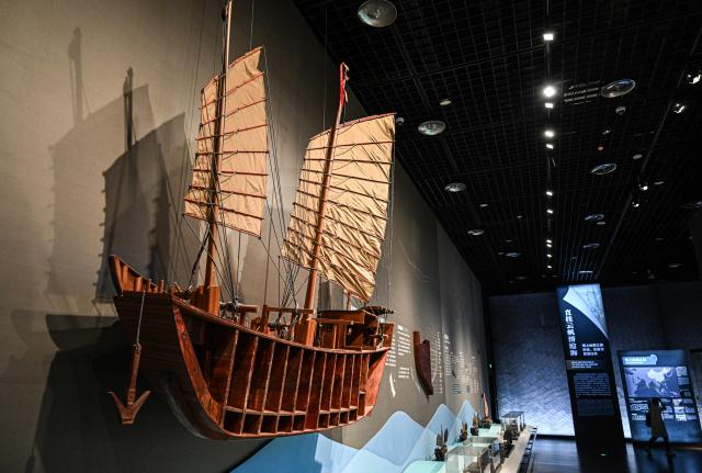 (250614) -- QIONGHAI, June 14, 2025 (Xinhua) -- This photo taken on May 17, 2023 shows an ancient ship model at the China (Hainan) Museum of the South China Sea in Qionghai, south China's Hainan Province. A great number of exhibits relevant to the Maritime Silk Road are showcased at the China (Hainan) Museum of the South China Sea, providing valuable insights into the prosperity of the Maritime Silk Road in ancient China and the exchanges between Chinese and foreign civilizations. (Xinhua/Pu Xiaoxu)