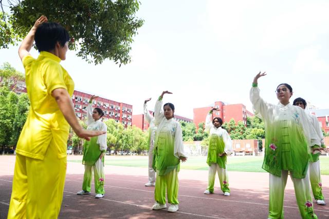 (250615) -- CHANGSHA, June 15, 2025 (Xinhua) -- Ekpene Mabel Solomon (3rd R) practices Baduanjin, a traditional form of Chinese aerobic exercise known for its health benefits, with other students at Changsha Medical University in Changsha, central China's Hunan Province, May 29, 2025.
  Ekpene Mabel Solomon, 21, was born in Nigeria and is now a junior student majored in clinical medicine at Changsha Medical University. Before coming to China, Ekpene had learned about traditional Chinese culture through television and the internet and become deeply interested in it. In 2022, she passed a selection exam and won a scholarship to study at the university.
  After enrollment, she has studied a wide range of subjects including Traditional Chinese Medicine (TCM) history and Baduanjin, a traditional form of Chinese aerobic exercise known for its health benefits. With outstanding grades, Ekpene was awarded the 2023-2024 Hunan provincial scholarship for international students.
  During her studies in China, she enjoys visiting museums and traveling to deepen her understanding of Chinese culture. In her spare time, the fashion-loving girl also creates makeup and lifestyle videos on social media.
  Though three more years to go until graduation, Ekpene has already mapped out her future plans. She hopes to stay in China for further studies, and then return to her country to contribute to the healthcare. (Xinhua/Xue Yuge)