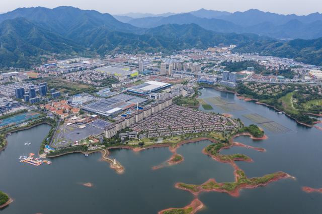 (250617) -- HANGZHOU, June 17, 2025 (Xinhua) -- An aerial drone photo taken on June 3, 2025 shows a view of the Chun'an economic development zone in east China's Zhejiang Province. Chun'an, located in east China's Zhejiang Province, is renowned for its water system and outstanding natural environment. As a national-level ecological county, it serves as a model for ecological protection and construction. (Xinhua/Xu Yu)