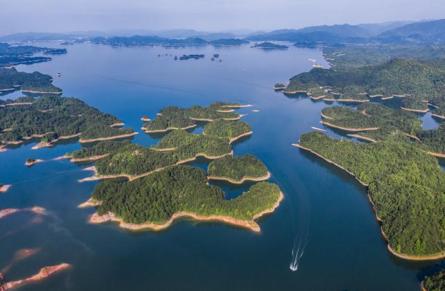 (250617) -- HANGZHOU, June 17, 2025 (Xinhua) -- An aerial drone photo taken on June 3, 2025 shows a view of the Qiandao Lake in east China's Zhejiang Province. Chun'an, located in east China's Zhejiang Province, is renowned for its water system and outstanding natural environment. As a national-level ecological county, it serves as a model for ecological protection and construction. (Xinhua/Xu Yu)