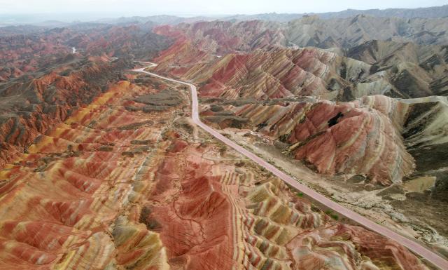 (250623) -- ZHANGYE, June 23, 2025 (Xinhua) -- An aerial drone photo taken on June 22, 2025 shows a view of Danxia landform in the rain at the Danxia National Geological Park in Zhangye, northwest China's Gansu Province. (Xinhua/Chen Bin)