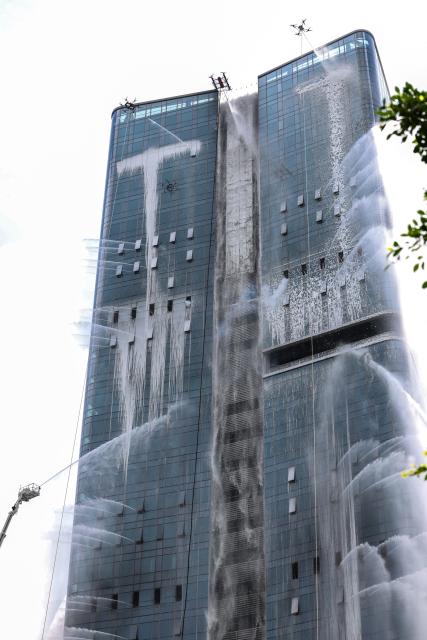(250625) -- SHENZHEN, June 25, 2025 (Xinhua) -- A fire drill for a high-rise building is carried out in Shenzhen, south China's Guangdong Province, June 24, 2025. A high-rise building fire drill aimed at testing the efficiency of high-tech firefighting methods and improving response time was held here on Tuesday. (Xinhua/Mao Siqian)