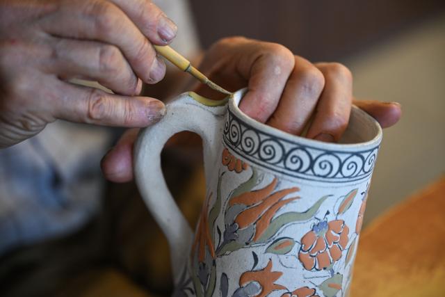 (250630) -- IZNIK (TÜRKIYE), June 30, 2025 (Xinhua) -- Master artisan Adil Can Guven makes a porcelain work at his studio in Iznik, Türkiye, on June 26, 2025. In the historic town of Iznik in northwestern Türkiye, renowned for its centuries-old ceramic tradition, master artisan Adil Can Guven is devoted to preserving and revitalizing this ancient craft. (Xinhua/Liu Lei) TO GO WITH Interview: Turkish master highlights enduring porcelain bond between Iznik, China