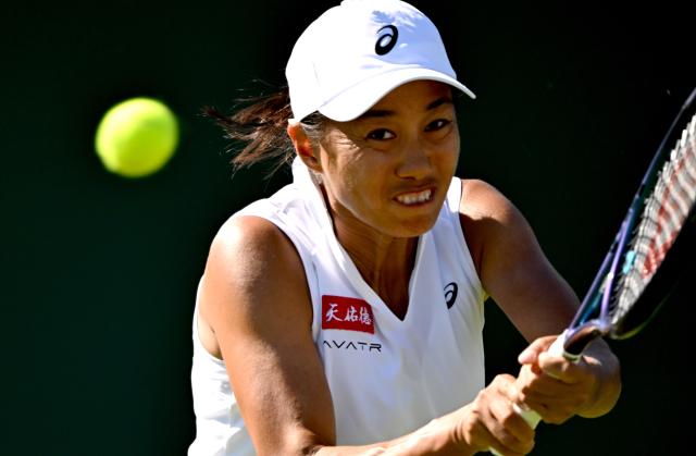 (250701) -- LONDON, July 1, 2025 (Xinhua) -- Zhang Shuai hits a return during the women's singles first round match between Zhang Shuai of China and Olga Danilovic of Serbia at Wimbledon tennis Championship in London, Britain, June 30, 2025. (Xinhua/Li Ying)