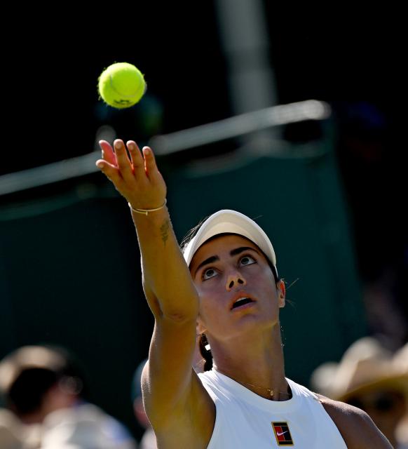 (250701) -- LONDON, July 1, 2025 (Xinhua) -- Olga Danilovi serves during the women's singles first round match between Zhang Shuai of China and Olga Danilovic of Serbia at Wimbledon tennis Championship in London, Britain, June 30, 2025. (Xinhua/Li Ying)