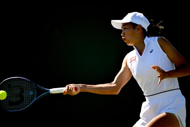 (250701) -- LONDON, July 1, 2025 (Xinhua) -- Zhang Shuai hits a return during the women's singles first round match between Zhang Shuai of China and Olga Danilovic of Serbia at Wimbledon tennis Championship in London, Britain, June 30, 2025. (Xinhua/Li Ying)