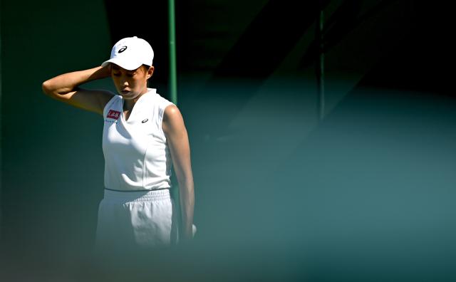 (250701) -- LONDON, July 1, 2025 (Xinhua) -- Zhang Shuai reacts during the women's singles first round match between Zhang Shuai of China and Olga Danilovic of Serbia at Wimbledon tennis Championship in London, Britain, June 30, 2025. (Xinhua/Li Ying)