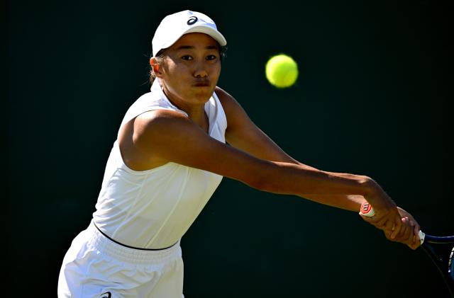 (250701) -- LONDON, July 1, 2025 (Xinhua) -- Zhang Shuai hits a return during the women's singles first round match between Zhang Shuai of China and Olga Danilovic of Serbia at Wimbledon tennis Championship in London, Britain, June 30, 2025. (Xinhua/Li Ying)