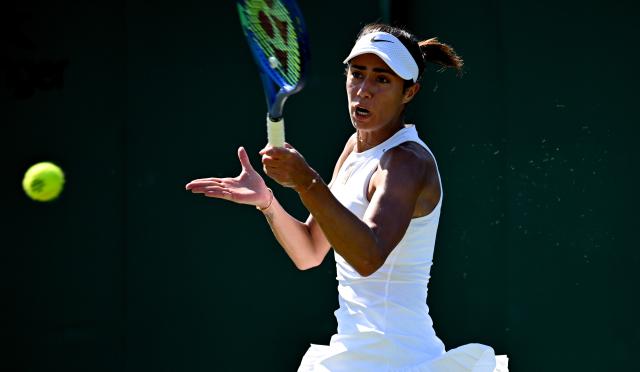 (250701) -- LONDON, July 1, 2025 (Xinhua) -- Olga Danilovi hits a return during the women's singles first round match between Zhang Shuai of China and Olga Danilovic of Serbia at Wimbledon tennis Championship in London, Britain, June 30, 2025. (Xinhua/Li Ying)