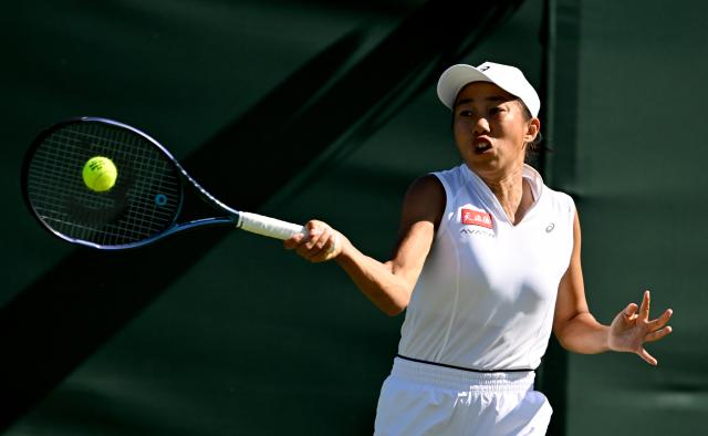 (250701) -- LONDON, July 1, 2025 (Xinhua) -- Zhang Shuai hits a return during the women's singles first round match between Zhang Shuai of China and Olga Danilovic of Serbia at Wimbledon tennis Championship in London, Britain, June 30, 2025. (Xinhua/Li Ying)