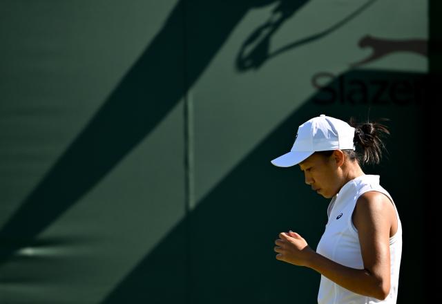 (250701) -- LONDON, July 1, 2025 (Xinhua) -- Zhang Shuai reacts during the women's singles first round match between Zhang Shuai of China and Olga Danilovic of Serbia at Wimbledon tennis Championship in London, Britain, June 30, 2025. (Xinhua/Li Ying)