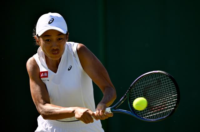 (250701) -- LONDON, July 1, 2025 (Xinhua) -- Zhang Shuai hits a return during the women's singles first round match between Zhang Shuai of China and Olga Danilovic of Serbia at Wimbledon tennis Championship in London, Britain, June 30, 2025. (Xinhua/Li Ying)