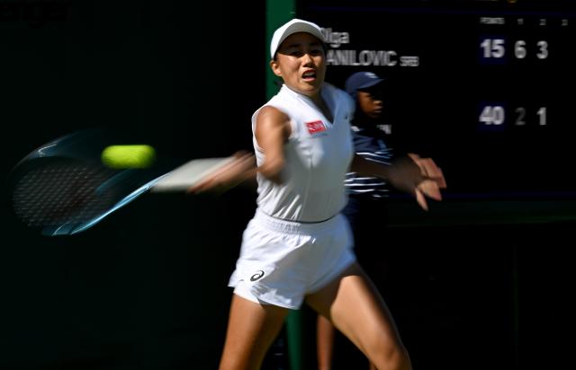 (250701) -- LONDON, July 1, 2025 (Xinhua) -- Zhang Shuai hits a return during the women's singles first round match between Zhang Shuai of China and Olga Danilovic of Serbia at Wimbledon tennis Championship in London, Britain, June 30, 2025. (Xinhua/Li Ying)