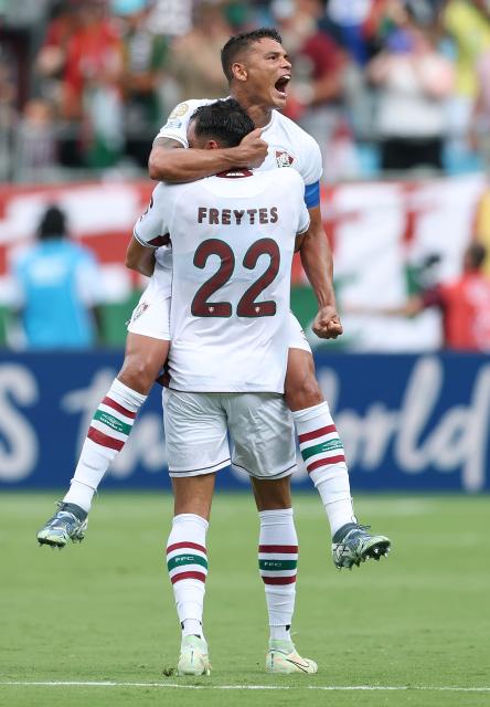 (250701) -- CHARLOTTE, July 1, 2025 (Xinhua) -- Thiago Silva (top) of Fluminense FC celebrates for the goal of teammate Hercules during the round of 16 match between Italy's FC Inter Milan and Brazil's Fluminense FC at the FIFA Club World Cup 2025 at the Bank of America Stadium, Charlotte, North Carolina, the United States, June 30, 2025. (Xinhua/Li Ming)