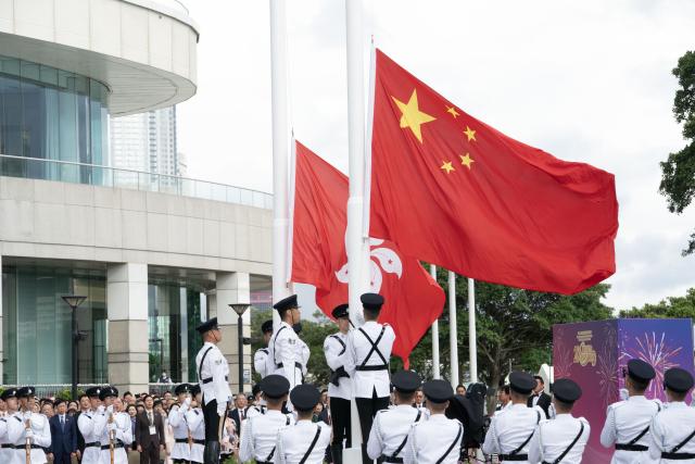 (250701) -- HONG KONG, July 1, 2025 (Xinhua) -- A flag-raising ceremony is held by the government of the Hong Kong Special Administrative Region (HKSAR) to celebrate the 28th anniversary of Hong Kong's return to the motherland at the Golden Bauhinia Square in Hong Kong, south China, July 1, 2025. (Xinhua/Lui Siu Wai)
