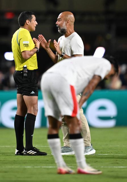 (250701) -- ORLANDO, July 1, 2025 (Xinhua) -- Pep Guardiola (R), head coach of Manchester City, talks with referee Jesus Valenzuela Saez during the round of 16 match between Manchester City of England and Al Hilal of Saudi Arabia at the FIFA Club World Cup 2025 at the Camping World Stadium, Orlando, Florida, the United States, June 30, 2025. (Xinhua/Wu Xiaoling)