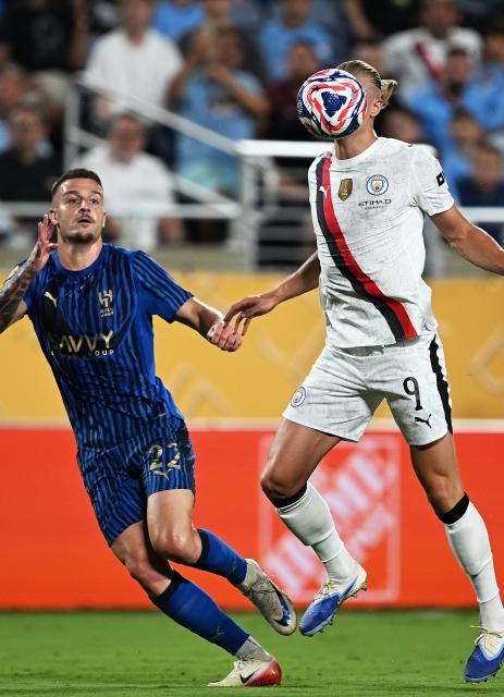 (250701) -- ORLANDO, July 1, 2025 (Xinhua) -- Erling Haaland (R) of Manchester City competes during the round of 16 match between Manchester City of England and Al Hilal of Saudi Arabia at the FIFA Club World Cup 2025 at the Camping World Stadium, Orlando, Florida, the United States, June 30, 2025. (Xinhua/Wu Xiaoling)