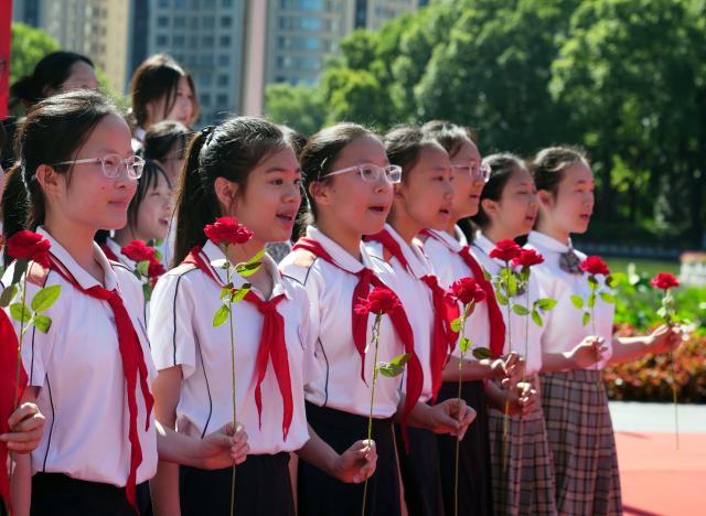 (250701) -- SHANGHAI, July 1, 2025 (Xinhua) -- Students chorus in front of the memorial of the First National Congress of the Communist Party of China in Shanghai, east China, July 1, 2025. A series of events celebrating the 104th founding anniversary of the Communist Party of China (CPC) were held at the memorial of the First National Congress of the CPC on Tuesday. (Xinhua/Liu Ying)