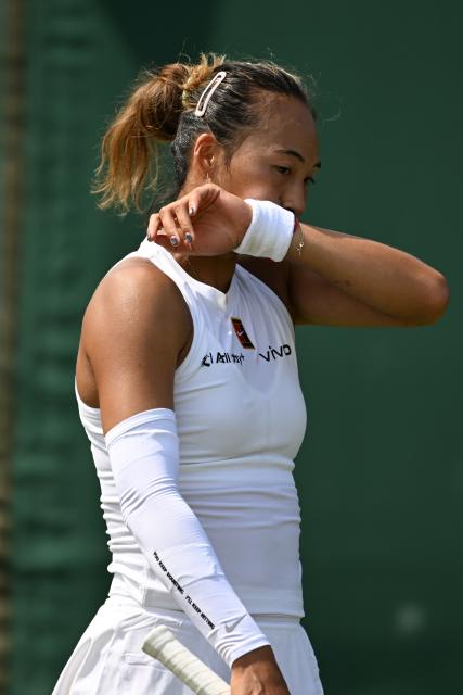 (250702) -- LONDON, July 2, 2025 (Xinhua) -- Zheng Qinwen reacts during the women's singles first round match between Zheng Qinwen of China and Katerina Siniakova of the Czech Republic at the Wimbledon Tennis Championships in London, Britain, July 1, 2025. (Xinhua/Zhao Dingzhe)