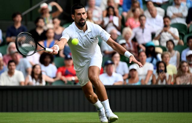 (250702) -- LONDON, July 2, 2025 (Xinhua) -- Novak Djokovic hits a return during the men's singles first round match between Novak Djokovic of Serbia and Alexandre Muller of France at the Wimbledon Tennis Championships in London, Britain, July 1, 2025. (Xinhua/Li Ying)