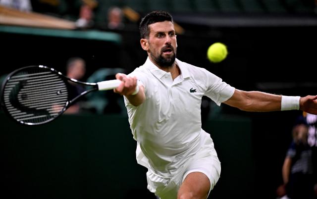 (250702) -- LONDON, July 2, 2025 (Xinhua) -- Novak Djokovic hits a return during the men's singles first round match between Novak Djokovic of Serbia and Alexandre Muller of France at the Wimbledon Tennis Championships in London, Britain, July 1, 2025. (Xinhua/Li Ying)