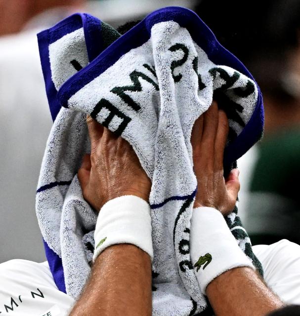 (250702) -- LONDON, July 2, 2025 (Xinhua) -- Novak Djokovic reacts during the men's singles first round match between Novak Djokovic of Serbia and Alexandre Muller of France at the Wimbledon Tennis Championships in London, Britain, July 1, 2025. (Xinhua/Li Ying)