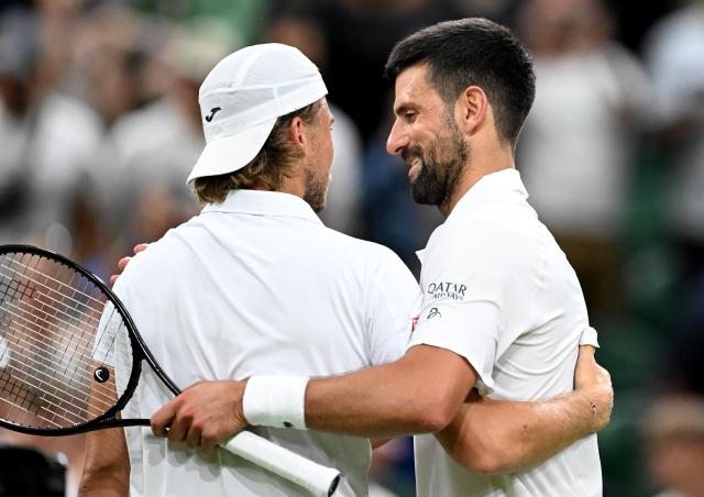 (250702) -- LONDON, July 2, 2025 (Xinhua) -- Novak Djokovic (R) greets Alexandre Muller after the men's singles first round match between Novak Djokovic of Serbia and Alexandre Muller of France at the Wimbledon Tennis Championships in London, Britain, July 1, 2025. (Xinhua/Li Ying)