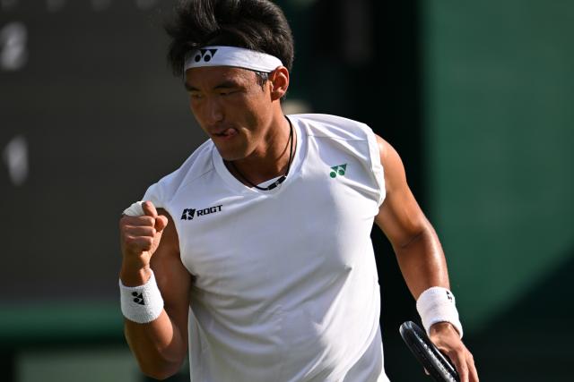(250702) -- LONDON, July 2, 2025 (Xinhua) -- Bu Yunchaokete celebrates scoring during the men's singles first round match between Bu Yunchaokete of China and Nakashima Brandon of the United States at the Wimbledon Tennis Championships in London, Britain, July 1, 2025. (Xinhua/Zhao Dingzhe)