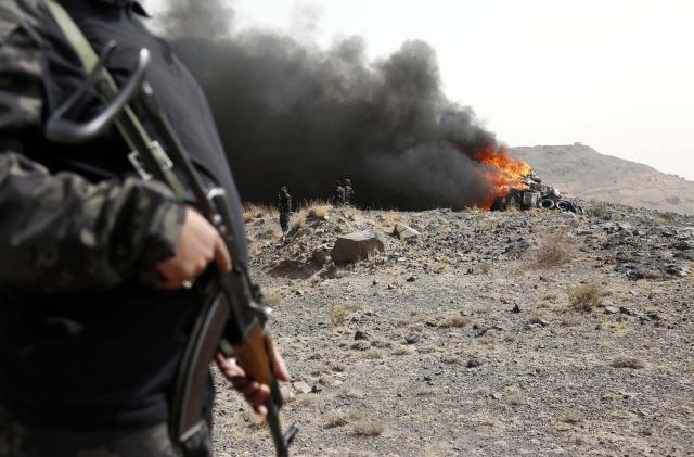 (250702) -- SANAA, July 2, 2025 (Xinhua) -- A soldier stands guard as illicit narcotics are being burned near Sanaa, Yemen, on July 1, 2025.
  Security forces of Yemen's Houthi group destroyed approximately 19 tons of narcotics, hashish and other illegal drugs here on Tuesday. (Photo by Mohammed Mohammed/Xinhua)