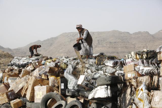 (250702) -- SANAA, July 2, 2025 (Xinhua) -- Workers prepare illicit narcotics to be destroyed near Sanaa, Yemen, on July 1, 2025.
  Security forces of Yemen's Houthi group destroyed approximately 19 tons of narcotics, hashish and other illegal drugs here on Tuesday. (Photo by Mohammed Mohammed/Xinhua)