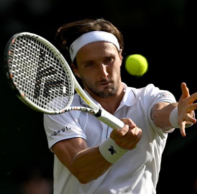 (250702) -- LONDON, July 2, 2025 (Xinhua) -- Arthur Rinderknech hits a return during the men's singles first round match between Alexander Zverev of Germany and Arthur Rinderknech of France at the Wimbledon Tennis Championships in London, Britain, July 1, 2025. (Xinhua/Li Ying)