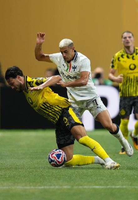(250702) -- ATLANTA, July 2, 2025 (Xinhua) -- CF Monterrey's German Berterame (R) vies with Borussia Dortmund's Ramy Bensebaini during the round of 16 match between Borussia Dortmund of Germany and CF Monterrey of Mexico at the FIFA Club World Cup 2025 at the Mercedes-Benz Stadium, Atlanta, Georgia, the United States, July 1, 2025. (Xinhua/Huang Zongzhi)