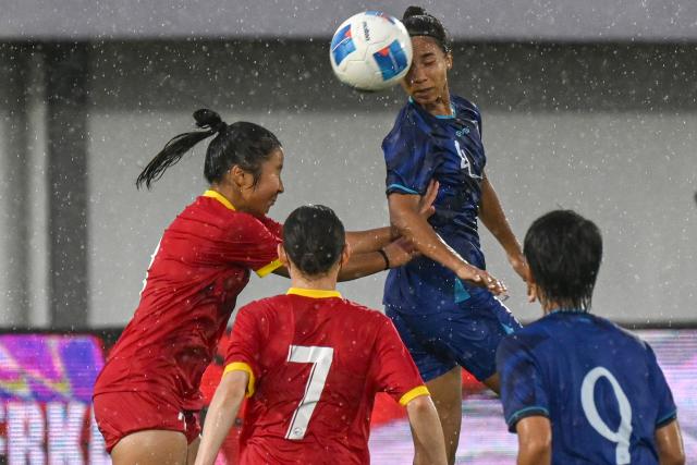 (250702) -- TANGERANG, July 2, 2025 (Xinhua) -- Tseng Yun-Ya (2nd R) of Chinese Taipei competes during the AFC Women's Asian Cup 2026 Qualifiers Group D football match between Kyrgyzstan and Chinese Taipei in Tangerang, Indonesia, July 2, 2025. (Xinhua/Agung Kuncahya B.)