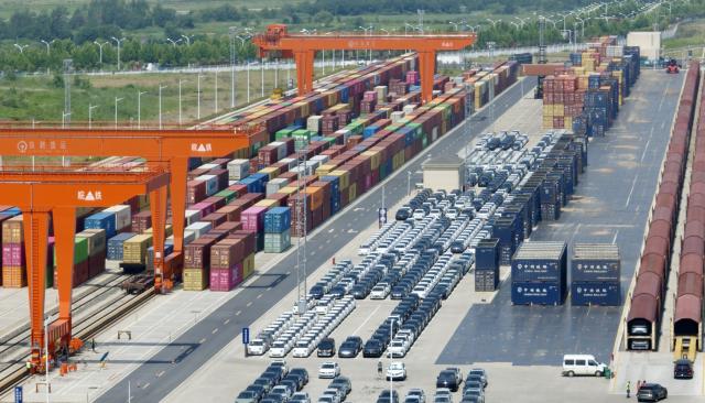 (250702) -- HEFEI, July 2, 2025 (Xinhua) -- An aerial drone photo shows new energy vehicles to be exported at the Paihe Port railway logistics base in Hefei, east China's Anhui Province, June 17, 2025.
  The city of Hefei is making big strides in the new energy vehicle (NEV) industry. In 2024, the city's NEV output exceeded 1.37 million units, with the total value of its industrial chain hitting 260 billion yuan (about 36.28 billion U.S. dollars). (Xinhua/Zhou Mu)