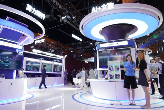 (250702) -- BEIJING, July 2, 2025 (Xinhua) -- This photo taken on July 2, 2025 shows an exhibition area of the 2025 Global Digital Economy Conference in Beijing, capital of China. With the theme "Building a Digital-Friendly City", the 2025 Global Digital Economy Conference opened here on Wednesday. (Xinhua/Zhang Chenlin)