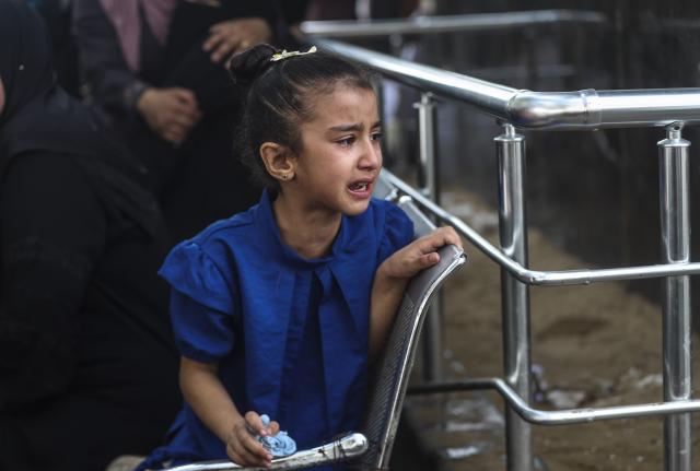 (250702) -- GAZA CITY, July 2, 2025 (Xinhua) -- A Palestinian mourns over victims who were killed in Israeli airstrikes, at a hospital in Gaza City, July 1, 2025. At least 45 Palestinians were killed by Israeli shelling and gunfire in the Gaza Strip on Tuesday, Gaza's Civil Defense said, while the Israeli army announced that it had attacked 140 targets in the coastal enclave over the past 24 hours. (Photo by Mahmoud Zaki/Xinhua)