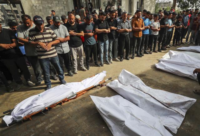 (250702) -- GAZA CITY, July 2, 2025 (Xinhua) -- Palestinians pray over victims who were killed in Israeli airstrikes, at a hospital in Gaza City, July 1, 2025. At least 45 Palestinians were killed by Israeli shelling and gunfire in the Gaza Strip on Tuesday, Gaza's Civil Defense said, while the Israeli army announced that it had attacked 140 targets in the coastal enclave over the past 24 hours. (Photo by Mahmoud Zaki/Xinhua)