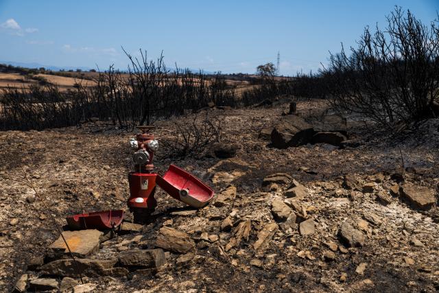 (250702) -- LLEIDA, July 2, 2025 (Xinhua) -- This photo taken on July 2, 2025 shows the burned land in Lleida province, Spain. Two farmers were killed in a wildfire that burned through 5,000 hectares in the La Segarra district of Lleida province, north-east Spain, on Tuesday, according to local emergency services. (Photo by Joan Gosa/Xinhua)