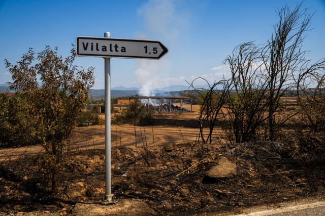 (250702) -- LLEIDA, July 2, 2025 (Xinhua) -- This photo taken on July 2, 2025 shows the burned land in Lleida province, Spain. Two farmers were killed in a wildfire that burned through 5,000 hectares in the La Segarra district of Lleida province, north-east Spain, on Tuesday, according to local emergency services. (Photo by Joan Gosa/Xinhua)