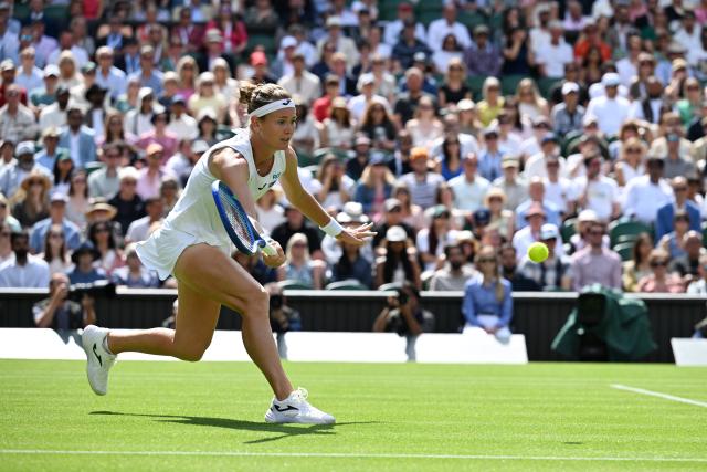 (250703) -- LONDON, July 3, 2025 (Xinhua) -- Marie Bouzkova hits a return during the women's singles second round match between Aryna Sabalenka of Belarus and Marie Bouzkova of the Czech Republic at the Wimbledon Tennis Championships in London, Britain, July 2, 2025. (Xinhua/Zhao Dingzhe)