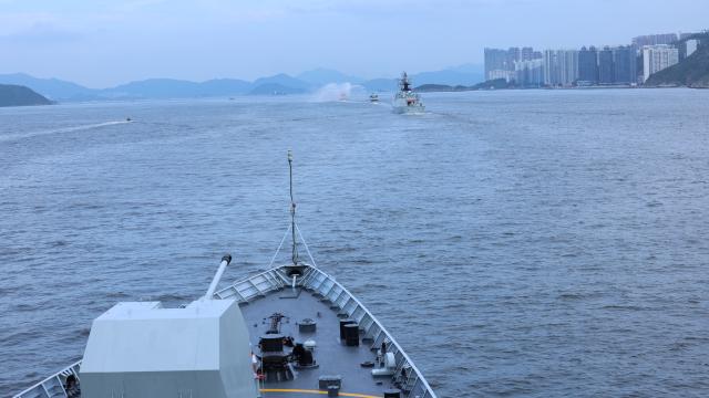 (250703) -- HONG KONG, July 3, 2025 (Xinhua) -- A fireboat of the Hong Kong Special Administrative Region government performs a water gate ceremony for the Chinese People's Liberation Army Navy fleet in Hong Kong, south China, July 3, 2025. A fleet of the Chinese People's Liberation Army Navy led by the aircraft carrier Shandong arrived here on Thursday morning. (Photo by Jia Xiaopeng/Xinhua)