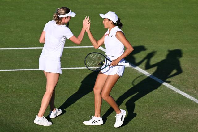(250703) -- LONDON, July 3, 2025 (Xinhua) -- Zhang Shuai (R)/Ekaterina Alexandrova react during the women's doubles first round match between Zhang Shuai (China)/Ekaterina Alexandrova (Russia) and Yuliia Starodubtseva/Nadiia Kichenok of Ukraine at the Wimbledon Tennis Championships in London, Britain, July 2, 2025. (Xinhua/Zhao Dingzhe)