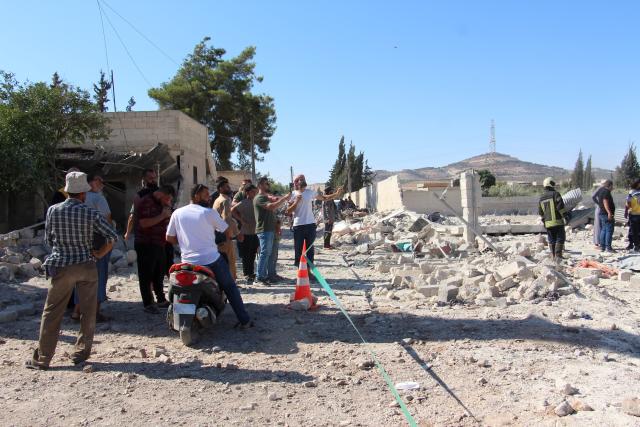 (250703) -- HAMA, July 3, 2025 (Xinhua) -- Residents and emergency workers inspect the destruction left behind after a deadly explosion in the town of Jibrin, in Hama province, central Syria, on July 2, 2025. At least seven people were killed and several others injured on Wednesday in a fuel tanker explosion in the town of Jibrin in Syria's central Hama province, state media reported.
   The explosion, which occurred when a fuel tanker caught fire, resulted in the deaths of civilians and left an undetermined number of others injured, Syrian state broadcaster al-Ikhbariya reported. (Str/Xinhua)