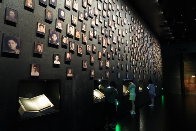 (250703) -- BEIJING, July 3, 2025 (Xinhua) -- People visit the Memorial Hall of the Victims in Nanjing Massacre by Japanese Invaders, in Nanjing, east China's Jiangsu Province, July 2, 2025. A "lights out" mourning ceremony for two survivors of the Nanjing Massacre who passed away this year was held Wednesday in Nanjing. This has brought the number of living registered survivors of the Massacre down to 26. (Photo by Liu Zhenrui/Xinhua)