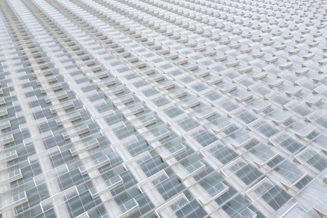 (250703) -- BEIJING, July 3, 2025 (Xinhua) -- An aerial drone photo taken on July 2, 2025 shows the smart glass greenhouses at a modern agricultural industrial park in Fuyuan City, northeast China's Heilongjiang Province. Located in the easternmost part of China, Fuyuan City is dubbed "the east pole of Huaxia (historical concept representing China)." In recent years, the city has continuously enhanced agricultural standardization and industrialization, vigorously developing modern agriculture that incorporates digital intelligence and ecological sustainability, a move expected to bring prosperity to the border area and improve locals' incomes. (Xinhua/Zhang Tao)