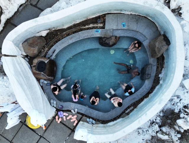 (250703) -- BEIJING, July 3, 2025 (Xinhua) -- A drone photo taken on Jan. 17, 2025 shows domestic and foreign tourists enjoying hot spring bath at Shenyang, northeast China's Liaoning Province. In recent years, Liaoning Province has actively built a facilitation system for cross-border cultural and tourism exchanges. It has participated in international tourism promotion activities, striving to enhance the quality of foreign-related tourism services and promote the high-quality development of inbound tourism. (Xinhua/Li Gang)