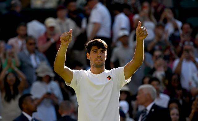 (250703) -- LONDON, July 3, 2025 (Xinhua) -- Carlos Alcaraz celebrates after winning the men's singles second round match between Carlos Alcaraz of Spain and Oliver Tarvet of Britain at the Wimbledon Tennis Championships in London, Britain, July 2, 2025. (Xinhua/Li Ying)