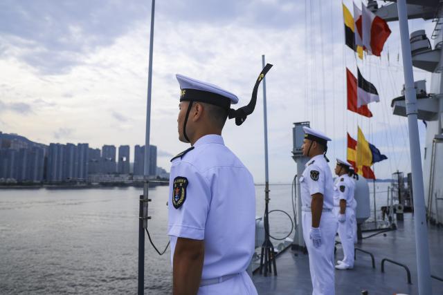 (250703) -- HONG KONG, July 3, 2025 (Xinhua) -- Soldiers line up on the deck of Zhanjiang missile destroyer during its visit to Hong Kong, south China, on July 3, 2025. A fleet of the Chinese People's Liberation Army Navy led by the aircraft carrier Shandong arrived here on Thursday morning. (Photo by Feng Li/Xinhua)