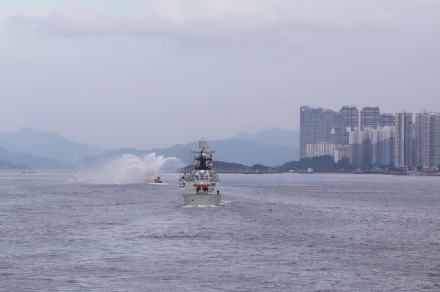 (250703) -- HONG KONG, July 3, 2025 (Xinhua) -- A fireboat of the Hong Kong Special Administrative Region government performs a water gate ceremony for the Chinese People's Liberation Army Navy fleet in Hong Kong, south China, July 3, 2025. A fleet of the Chinese People's Liberation Army Navy led by the aircraft carrier Shandong arrived here on Thursday morning. (Xinhua/Li Yun)