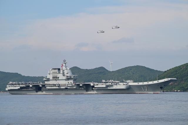 (250703) -- HONG KONG, July 3, 2025 (Xinhua) -- This photo shows the aircraft carrier Shandong sailing in Hong Kong waters, south China, July 3, 2025. A fleet of the Chinese People's Liberation Army Navy led by the aircraft carrier Shandong arrived in the Hong Kong Special Administrative Region on Thursday morning. (Xinhua/Zhu Wei)
